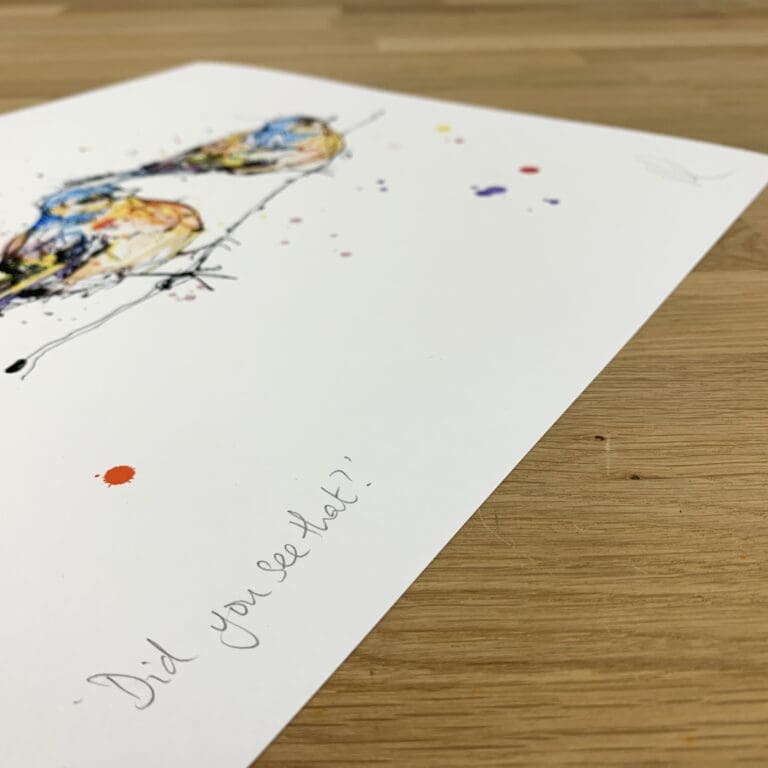 Photograph of Did You See That?, a print of two chaffinches on a branch by Kathryn Callaghan, which shows the print's title handwritten in the bottom left corner and the artist's signature in the bottom right, with space between to add a custom personalisation.