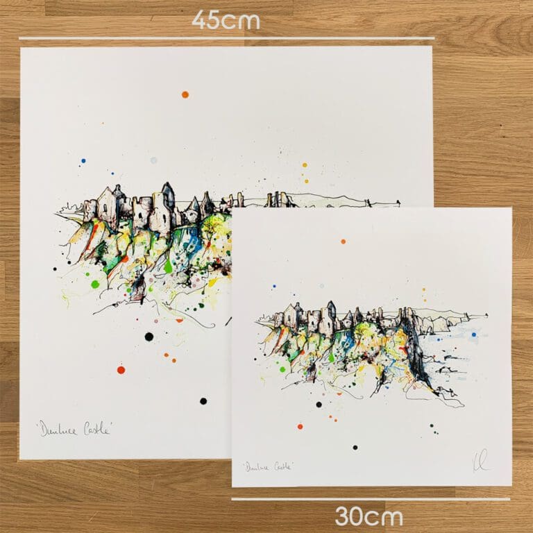 Two prints of Dunluce Castle, a Northern Ireland print by Kathryn Callaghan, to show the size difference between the 45cm print and the 30cm print.