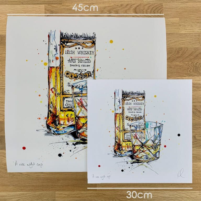 Two prints of A Wee Night Cap, a whiskey print by Kathryn Callaghan, to show the size difference between the 45cm print and the 30cm print.