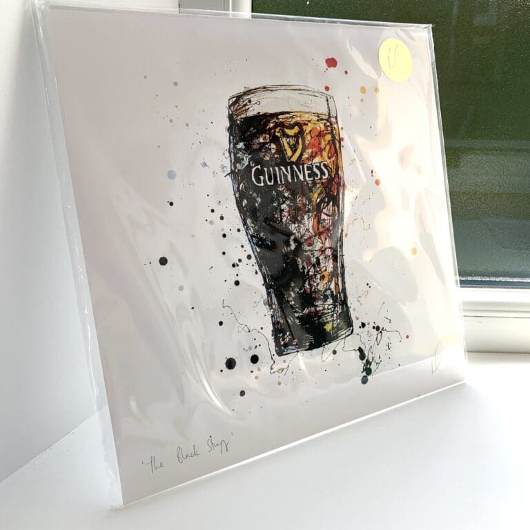 A print of The Black Stuff, which features a glass of Guinness by Kathryn Callaghan. The 30cm print is presented flat in a clear cello bag with a golden KC sticker in the top right.