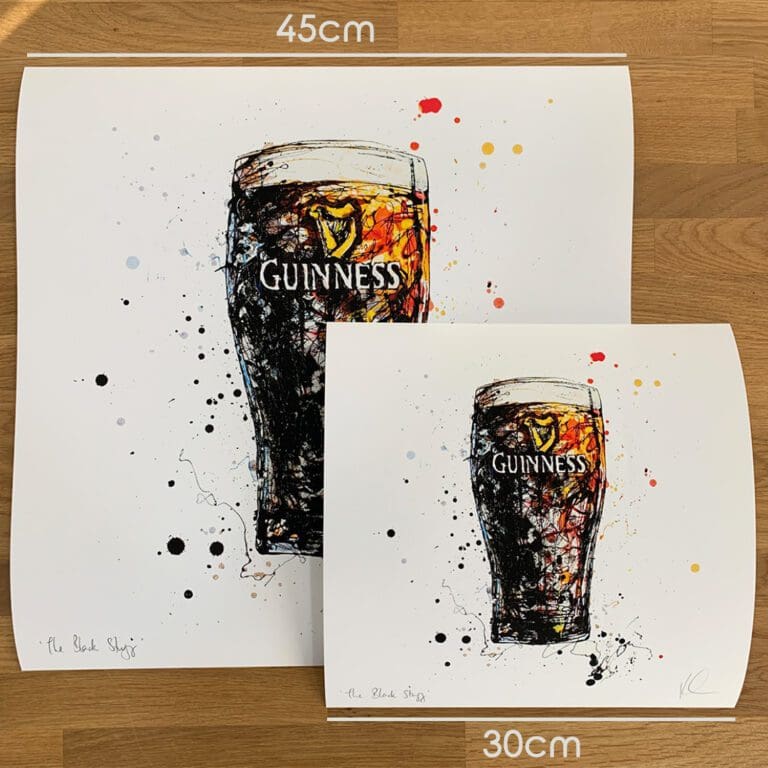 Two prints of The Black Stuff by Kathryn Callaghan, which portrays a glass of Guinness, to show the size difference between the 45cm print and the 30cm print.