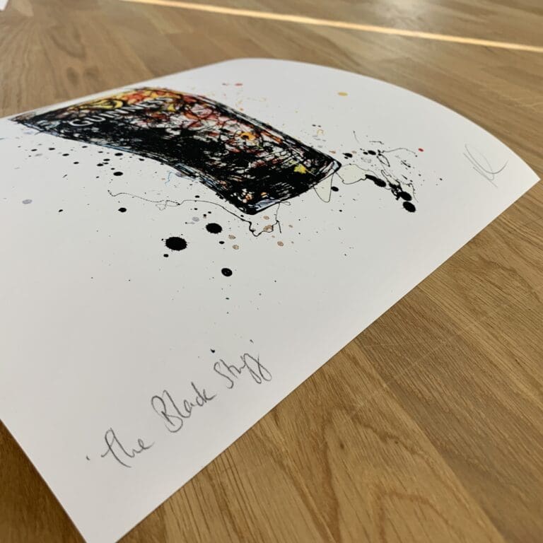 Photograph of The Black Stuff, a Guinness print by Kathryn Callaghan, which shows the print's title handwritten in the bottom left corner and the artist's signature in the bottom right, with space between to add a custom personalisation.