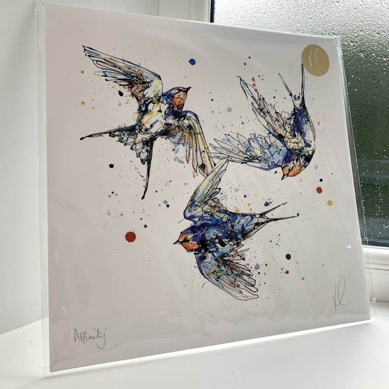 A print of Affinity by Kathryn Callaghan, which features three swallows flying in a loop. The 30cm print is presented flat in a clear cello bag with a golden KC sticker in the top right.