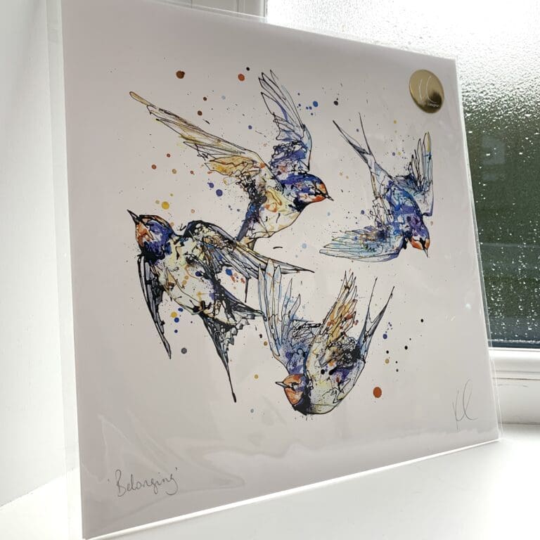 A print of Belonging by Kathryn Callaghan, which features four swallows flying in a loop. The 30cm print is presented flat in a clear cello bag with a golden KC sticker in the top right.