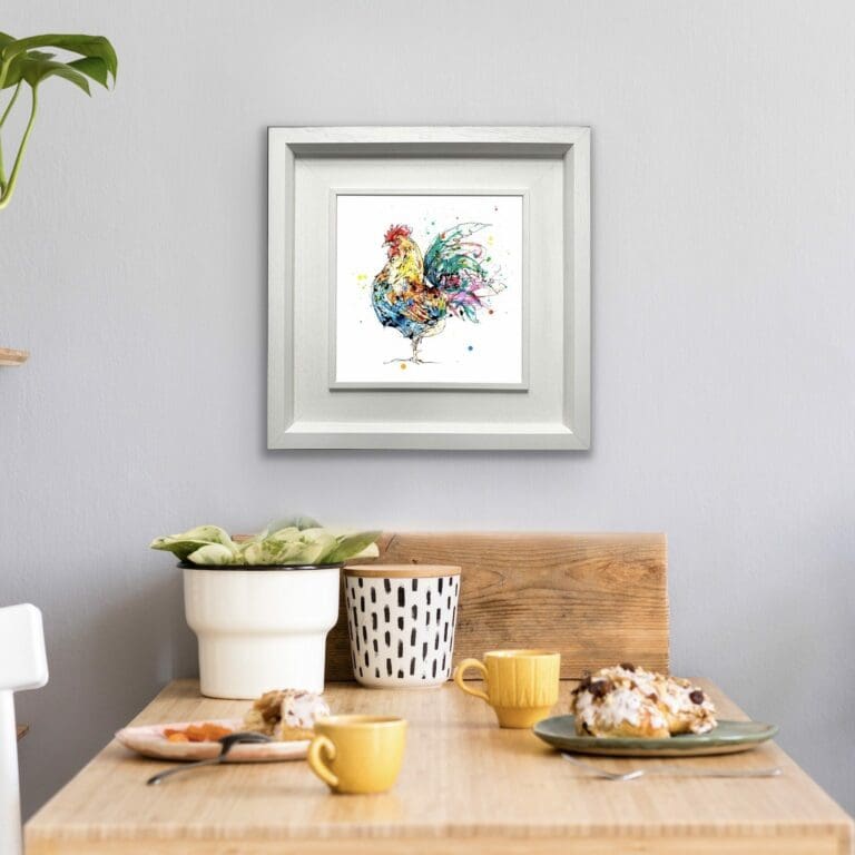 Clarence Cockerel Chicken Print shown in Deluxe White Frame in situ above breakfast table