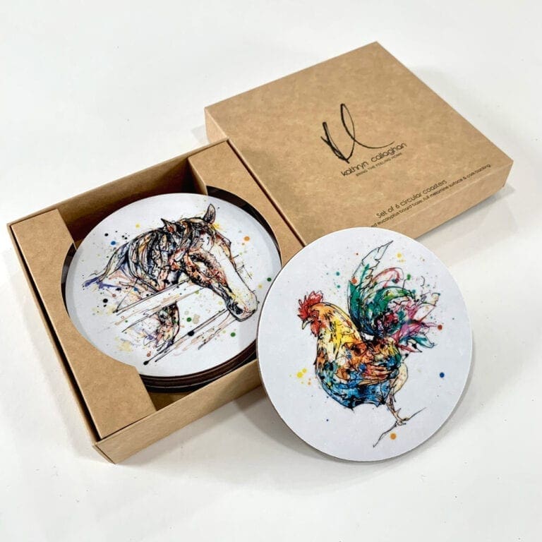 A gift set of farmyard coasters in a branded box by Kathryn Callaghan. At the top of the set are a horse print named Hudson and a cockerel print named Clarence.