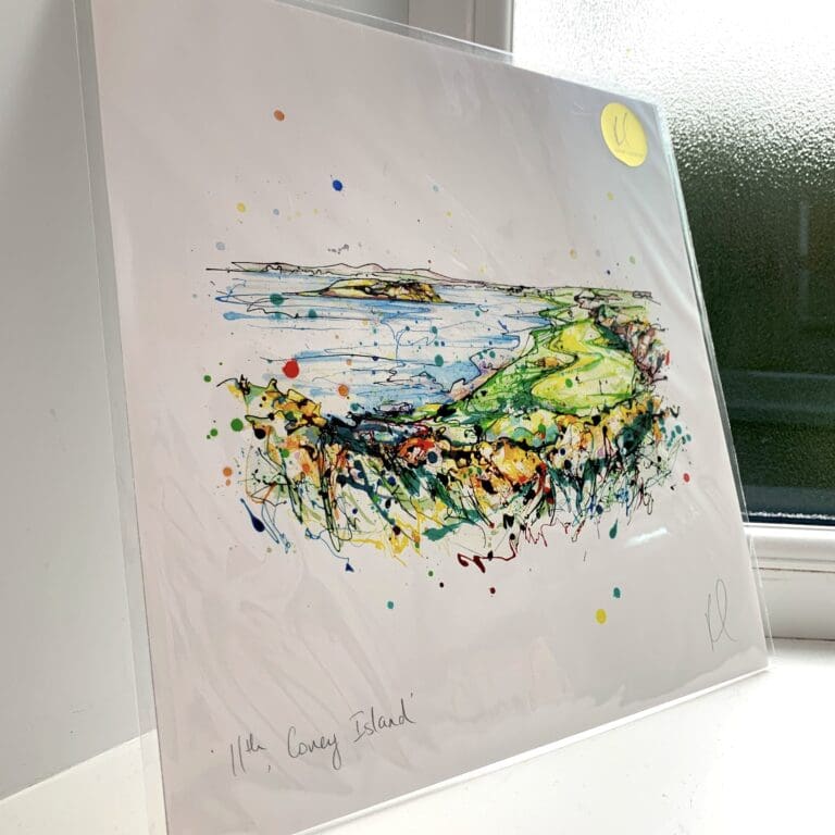 A print of 11th Coney Island by Kathryn Callaghan, which features the 11th hole at Ardglass Golf Club. The 30cm print is presented flat in a clear cello bag with a golden KC sticker in the top right.