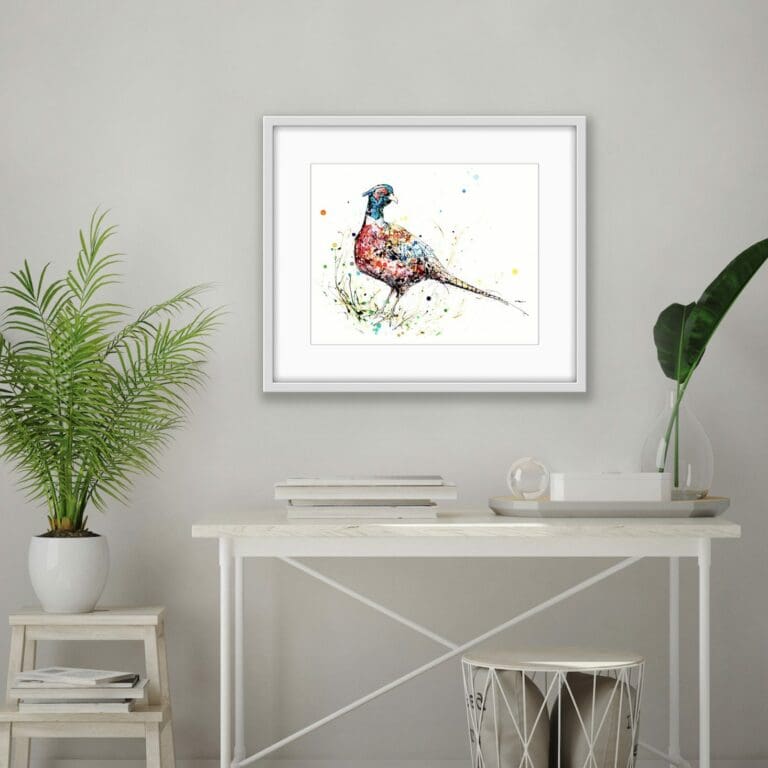 Resplendent Limited Edition pheasant print displayed in white frame above white desk