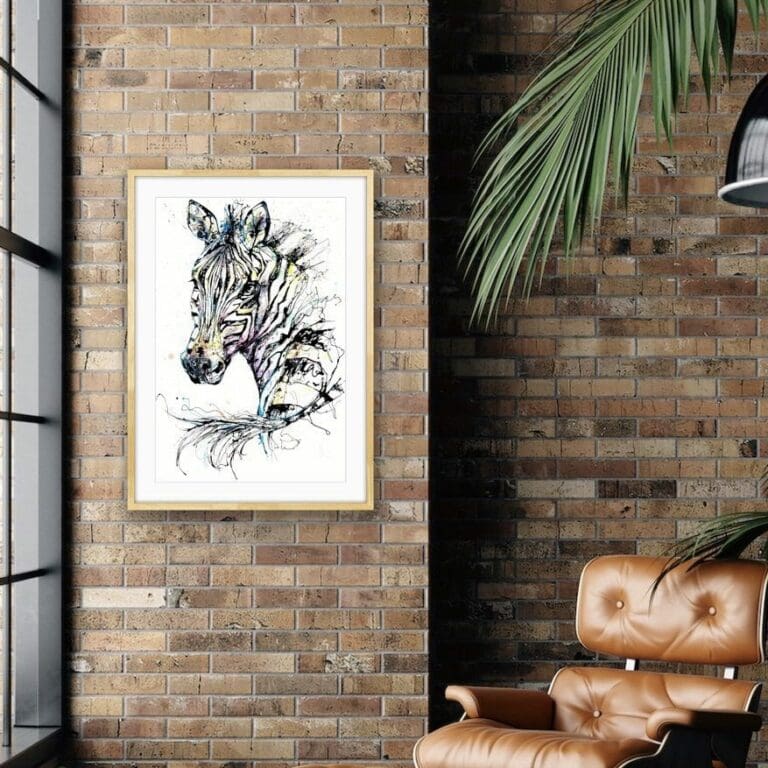 Unforgettable Zebra Print shown Framed in Situ on brick wall with leather chair and houseplant