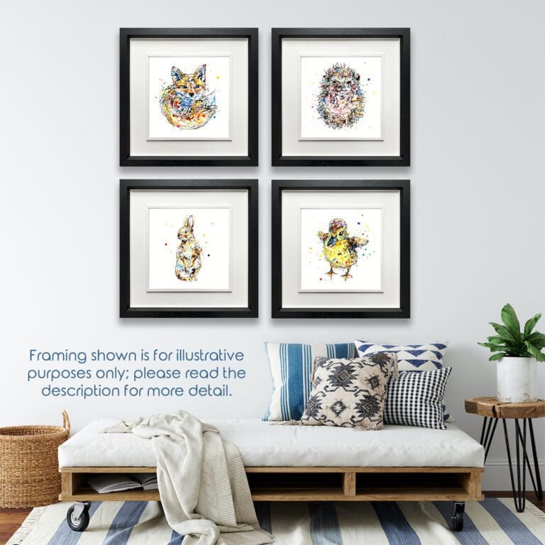 Four prints in deluxe black frames hang in a grid in a white walled room above a futon. The prints are a fox cub called Milkshake, a hedgehog called Pickles, a baby bunny rabbit called Pumpkin, and a duckling called Sherbet.