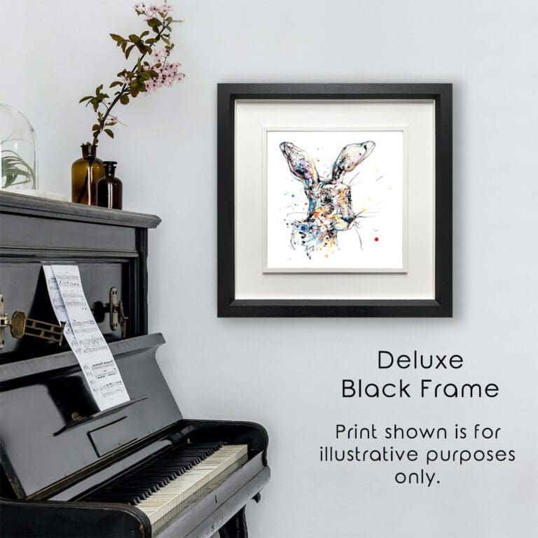 Hartley Hare Print shown in a Deluxe Black Frame in Situ next to a black piano.