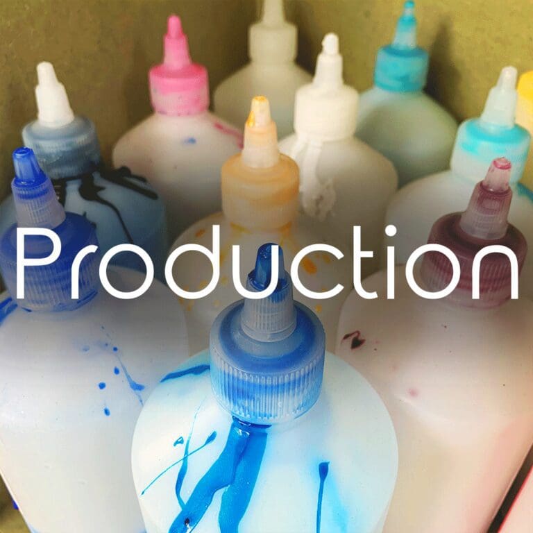 A set of colourful stained ink bottles with the word Production in clear white text over the top.