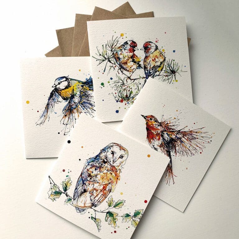 All four greetings cards featuring bird prints by Kathryn Callaghan included in the eight-card gift set, along with included envelopes. The cards feature I Turn To You, two goldfinches on a fir branch, Airborne, a robin in flight, Curio, a barn owl on an oak branch, and Coat of Colour, a blue tit in flight.