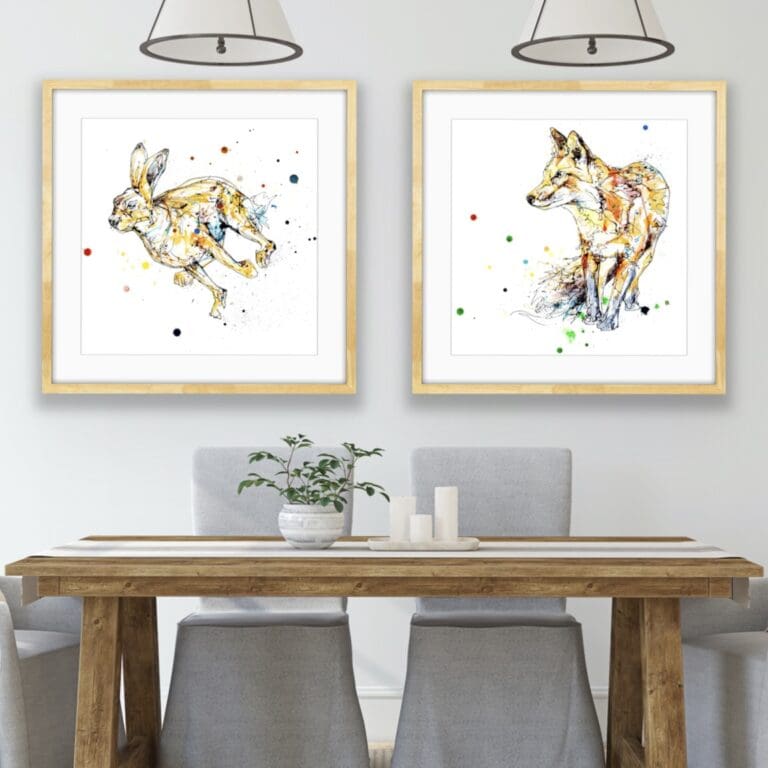 Dash Running Hare and Treasure Hunt Fox Prints shown framed in situ above a dining table.