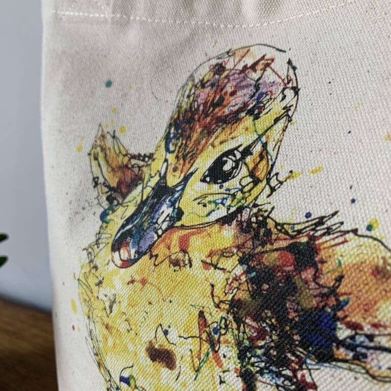 Close up of a canvas bucket bag featuring a painting of a duckling called Sherbet by Kathryn Callaghan.