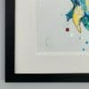Close up showing the artist's signature, double mount, and black box frame of Splash, original dolphin painting by Kathryn Callaghan.