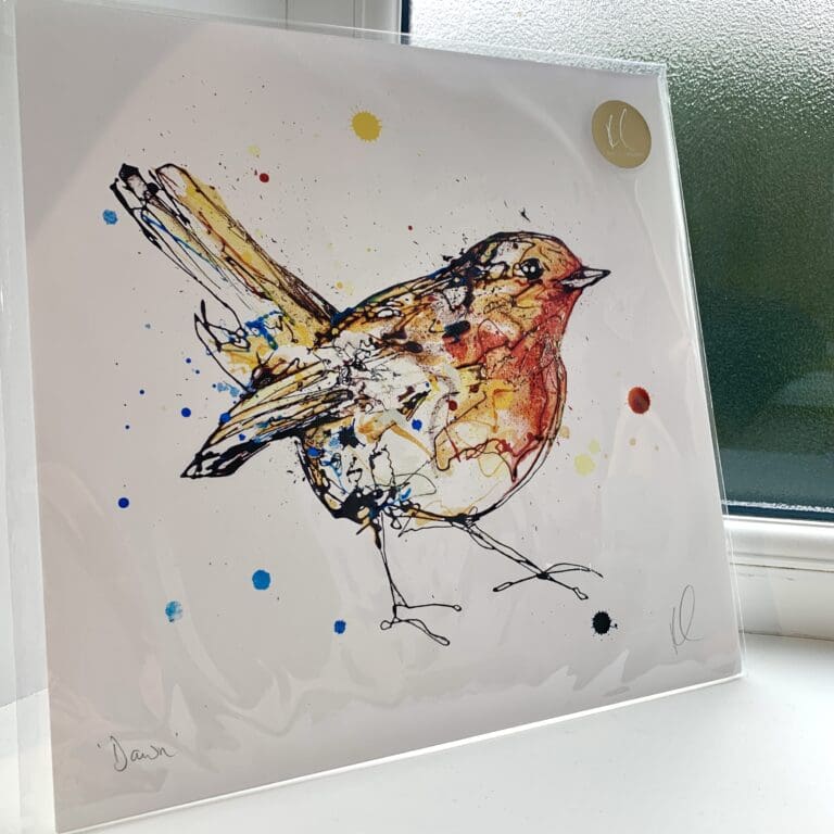 A print of Dawn by Kathryn Callaghan, which features a bright eyed robin looking at the viewer. The 30cm print is presented flat in a clear cello bag with a golden KC sticker in the top right.