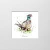 A digital mockup showing how a miniature print of Attention by Kathryn Callaghan will look presented in a 23cm mount. The print features the an alert pheasant looking back at the viewer.