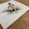 Photograph of Attention by Kathryn Callaghan, which shows the print's title handwritten in the bottom left corner and the artist's signature in the bottom right, with space between to add a custom personalisation.