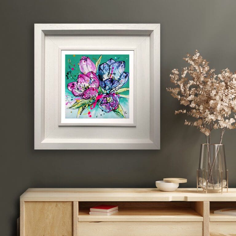 Peace, a green floral print by Kathryn Callaghan, shown in a Deluxe White Frame in situ on an olive green wall above a pine sideboard dotted with ceramic dishes and a base of dried flowers.