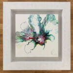 An original abstract painting by Kathryn Callaghan, named Always. The painting features a bloom of pale gree, turquoise, purple, and red blooming from the centre, and is framed in a deep floating white wood frame.