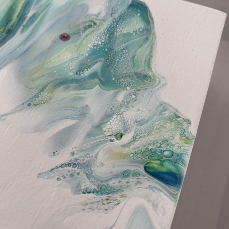 A close up photograph showing the intricate organic detail of reacting green, blue and white paints present on Always, an original abstract painting by Kathryn Callaghan.