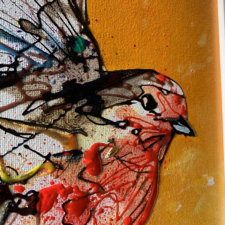 A close up photograph showing the use of colour and texture in 'Fly High', an original robin painting by Kathryn Callaghan.