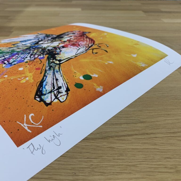 Photograph of Fly High by Kathryn Callaghan, which shows the print's title handwritten in the bottom left corner and the artist's signature in the bottom right, with space between to add a custom personalisation.