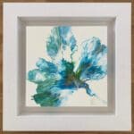 An original abstract painting by Kathryn Callaghan, named Hope. The painting features a bloom of vibrant green, gold and turquoise outward from the lower right corner, and is framed in a deep floating white wood frame.