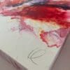 Close up photograph showing Kathryn Callaghan's pencil signature on the surface of Passion, her original abstract painting.