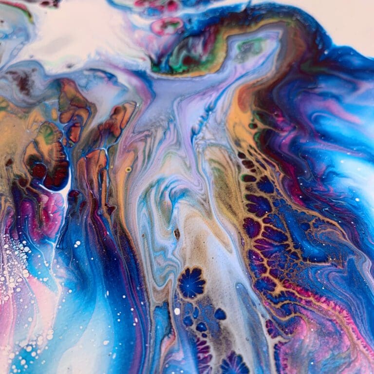 A close up photograph showing the intricate organic detail of reacting blue, pink, green, gold and white paints present on Revival, an original abstract painting by Kathryn Callaghan.