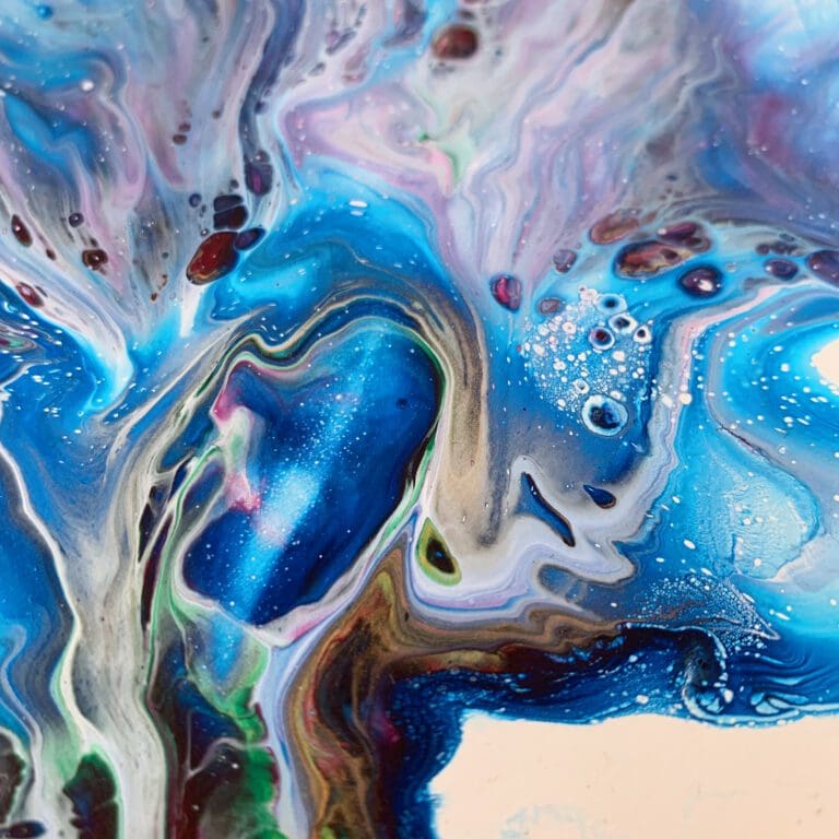 A close up photograph showing the intricate organic detail of reacting blue, pink, green, gold and white paints present on Revival, an original abstract painting by Kathryn Callaghan.