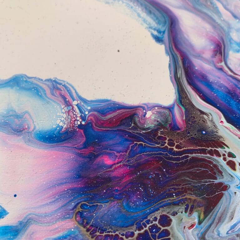 A close up photograph showing the intricate organic detail of reacting blue and pink paints present on Revival, an original abstract painting by Kathryn Callaghan.