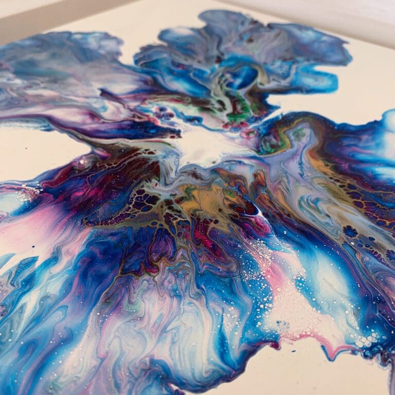 A close up photograph showing the intricate organic detail of reacting blue, pink, green, gold and white paints present on Revival, an original abstract painting by Kathryn Callaghan.