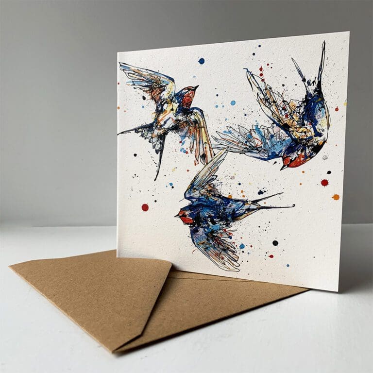 A greetings card by Kathryn Callaghan featuring Affinity, a print of a family of three swallows flying in a circle, sitting alongside its brown paper envelope.