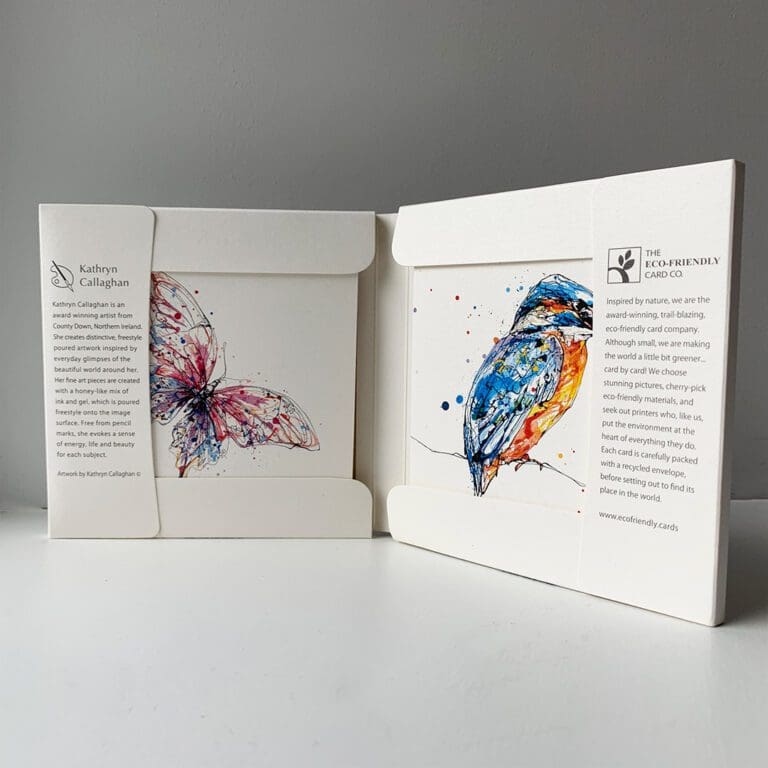 The inners of the paper wallet packing for the new set of 8 greetings cards by Kathryn Callaghan. The inner gives a brief bio on Kathryn as an artist based in Co Down Northern Ireland who works with a unique poured art style. Two of the four card designs are visible: Flutterfly the pink butterfly and Gaze the kingfisher.