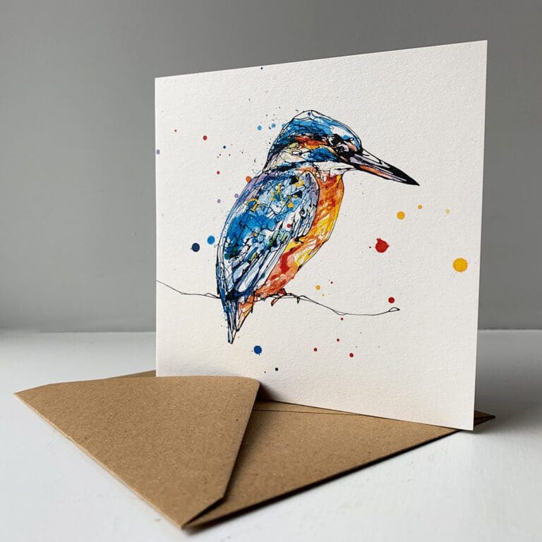 A greetings card by Kathryn Callaghan featuring Gaze, a print of perched kingfisher, sitting alongside its brown paper envelope.