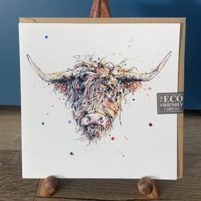 A greetings card featuring a print of a friendly highland cow named Harris by Kathryn Callaghan.