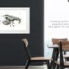 Claws, a print of a European lobster by Kathryn Callaghan, shown in a white frame in a dark boardroom.