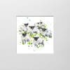 A digital mockup showing how a miniature print of Baa by Kathryn Callaghan will look presented in a 23cm mount. Baa features a flock of Scottish Blackface sheep looking curiously at the viewer.