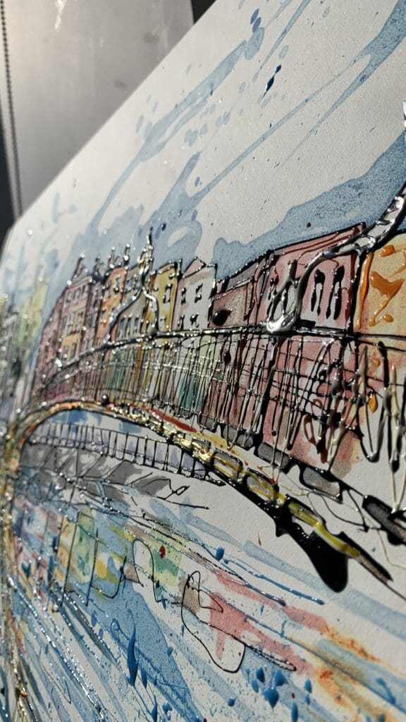 A close up of an original poured painting by Kathryn Callaghan of the Ha'penny Bridge in Dublin. The photograph is taken from a low angle and shows the texture of the ink gels in the sunlight.