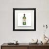 Jameson Irish Whiskey, a print by Kathryn Callaghan, shown in a deluxe black frame hung in situ above a wooden sideboard.