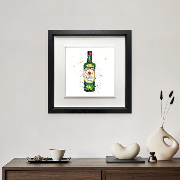 Jameson Irish Whiskey, a print by Kathryn Callaghan, shown in a deluxe black frame hung in situ above a wooden sideboard.