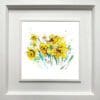 A vivid daffodil print by Kathryn Callaghan, named 'Happy Days', displayed in a Deluxe White frame.