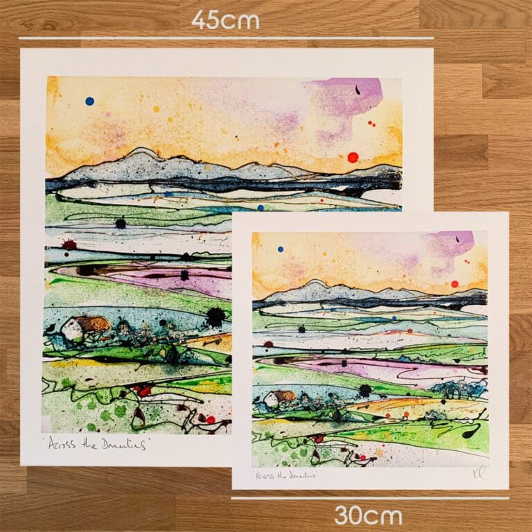 Two prints of Across the Drumlins Kathryn Callaghan to show the size difference between the 45cm print and the 30cm print.