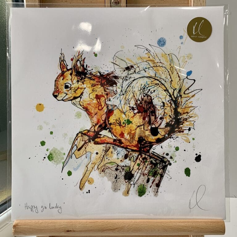 A print of Happy Go Lucky by Kathryn Callaghan, which features a red squirrel perched on a stump. The 30cm print is presented flat in a clear cello bag with a golden KC sticker in the top right.