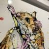 Close up detail of Just Hanging Around, an original mouse painting, to show the texture and detail of ink and gel on the surface, and the use of gold and silver leaf.