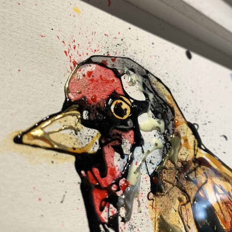 Close up detail of Sundown, an original goldfinch painting, to show the texture and detail of ink and gel on the surface, and the use of gold and silver leaf.