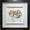 An original painting named Three Amigos by Kathryn Callaghan, featuring three mice clambering on a sprig of holly. The painting is framed in a two part white and black frame.