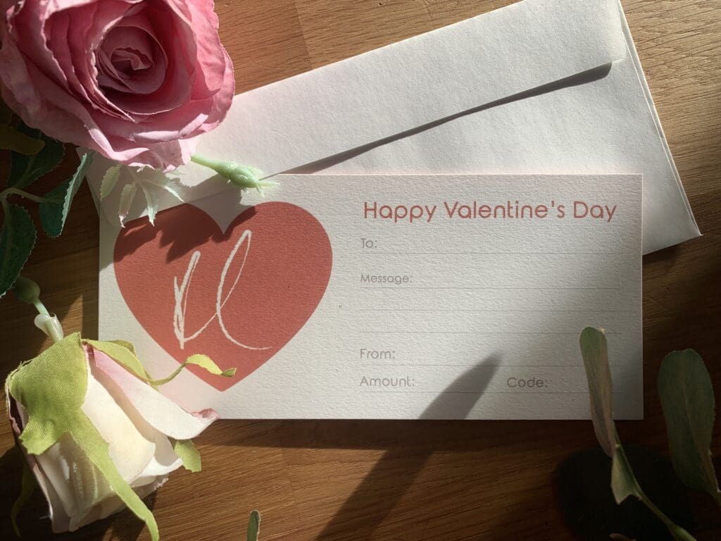 A gift voucher for Kathryn Callaghan, with text reading "Happy Valentine's Day", and a red heart with Kathryn's KC logo.